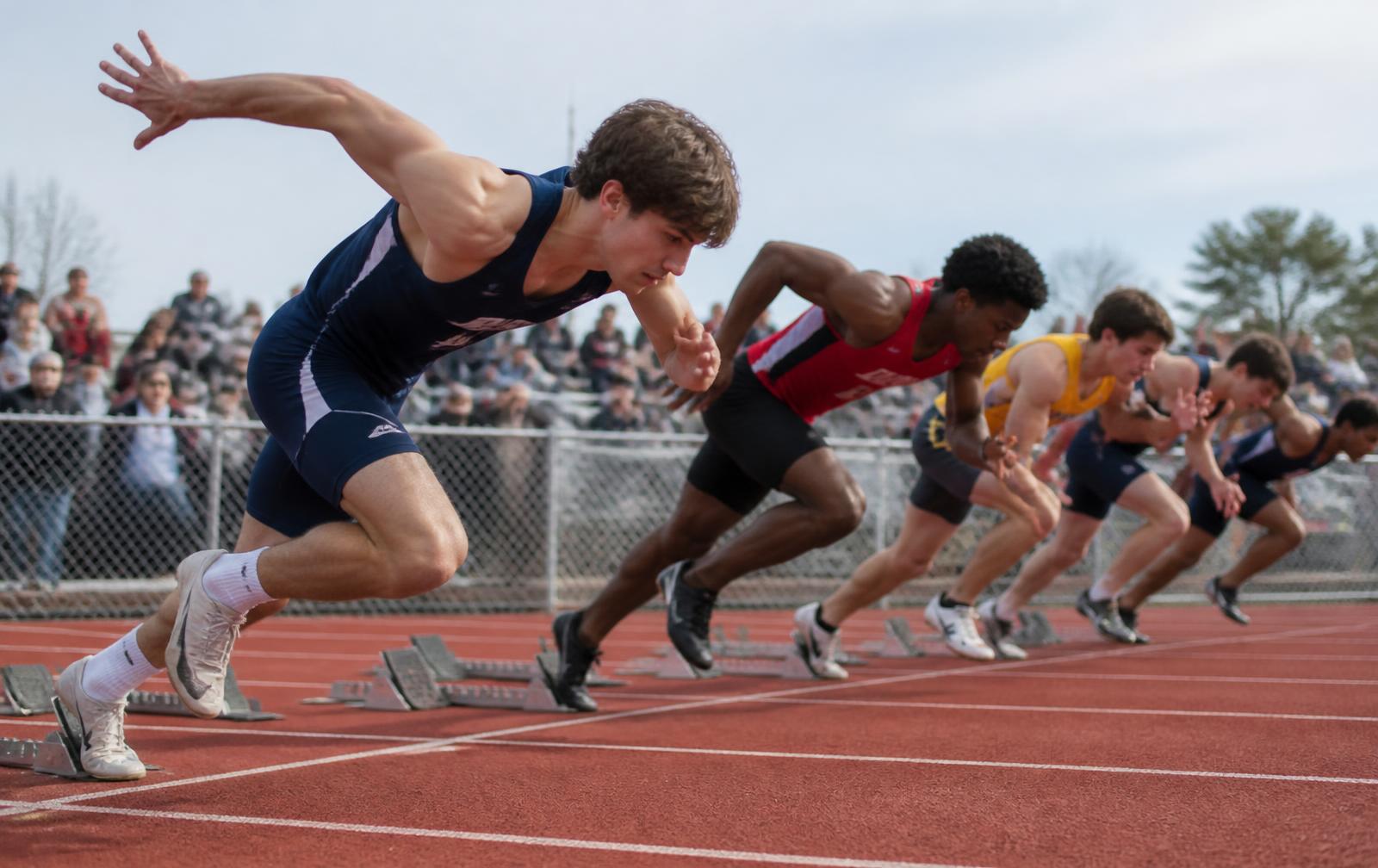 Sprinters starting a race on the track